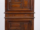 an image of a wooden cabinet with a door on top of it