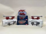 three red and white firetrucks sitting on top of each other