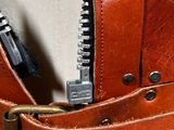a close up of a purse with a zipper on it