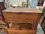 a wooden table with a drawer on top of it