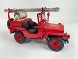 a red toy truck with a barrel on the back of it