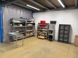 a room with a lot of shelves and a table in it