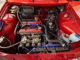 a red car that has a bunch of wires in it