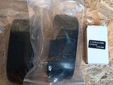 two pieces of plastic sitting on top of a wooden table