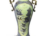 a vase with a handle on a stand on a white background