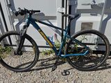 a bike that is parked in front of a container