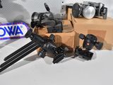 many different types of cameras on display on a table