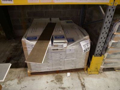 a stack of boxes on a pallet in a warehouse