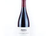 a close up of a bottle of wine on a white background