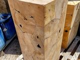 a large wooden block sitting on a pallet in the yard