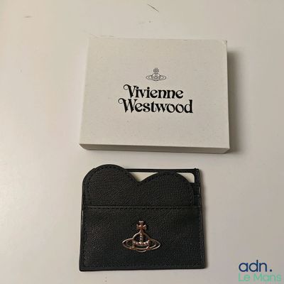 the card case is black and has a gold crown on it