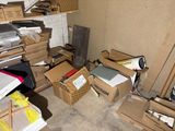 a pile of boxes and other items in a room