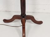 a small table with a lamp on top of it