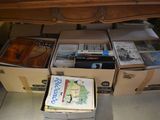 boxes of books are stacked on top of each other on the floor