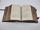 a open book on a white table with a white background