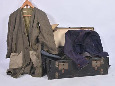 a suit case with a coat and a jacket in it