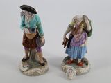 paire de figurines en porcelaine représentant un homme et une femme