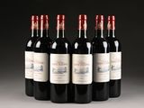 six bottles of red wine are lined up in a row
