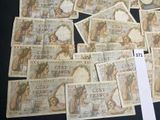 a lot of old french bank notes on a table
