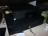 a black computer sitting on top of a white desk