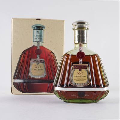 a bottle of brandy in front of a box