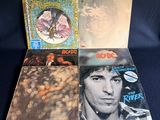 three record albums of the rolling stones, including a picture of a man with a butterfly on his head