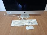 a computer monitor, keyboard, mouse and mouse on the table