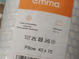 a close up of a pillow with a label on it