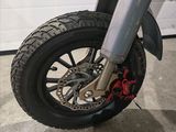 a close up of a motorcycle tire on the ground