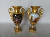two vases that are sitting on a table