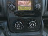 a picture of a car dashboard with a tv in it