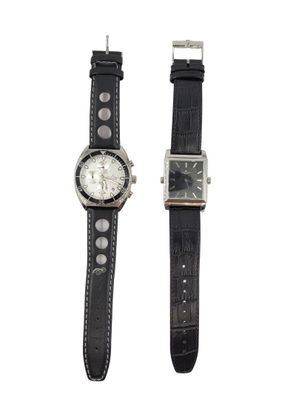 pair of black leather watch bands with silver buckles on a white background