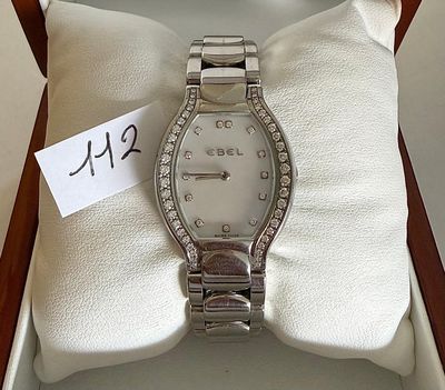 a watch in a box with a price tag on it