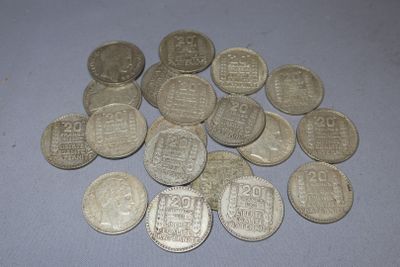 a pile of silver coins sitting on a table
