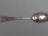 silver spoon on a gray surface