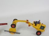 two toy vehicles that are sitting next to each other