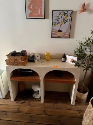 a picture of a living room with a couch and a table