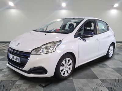 the white car is parked on a checkered floor in the garage