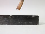 an image of a hammer hitting a piece of metal with a wooden handle