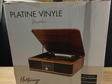 a box with a record player inside of it on a table