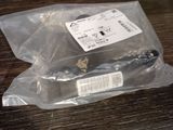 a plastic bag that has a knife in it on a table