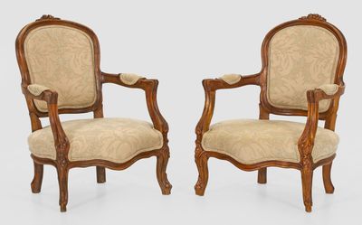 pair of louis xv style carved walnut armchairs