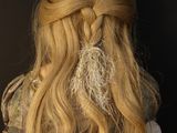 a woman with long blonde hair wearing a white dress