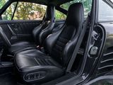 a picture of the interior of a car with black leather seats