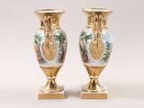 two vases that have been decorated with flowers on them