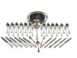 a lot of forks and spoons that are arranged in the shape of a heart