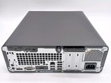 the back view of a computer with a hard drive on top of it