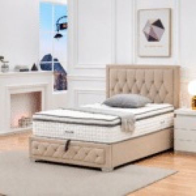 the bed is made and has a mattress on top of it