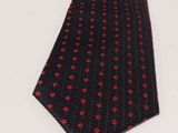 a close up of a neck tie on a white surface