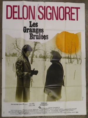 french movie poster for les granges brulees, starring delon signoret